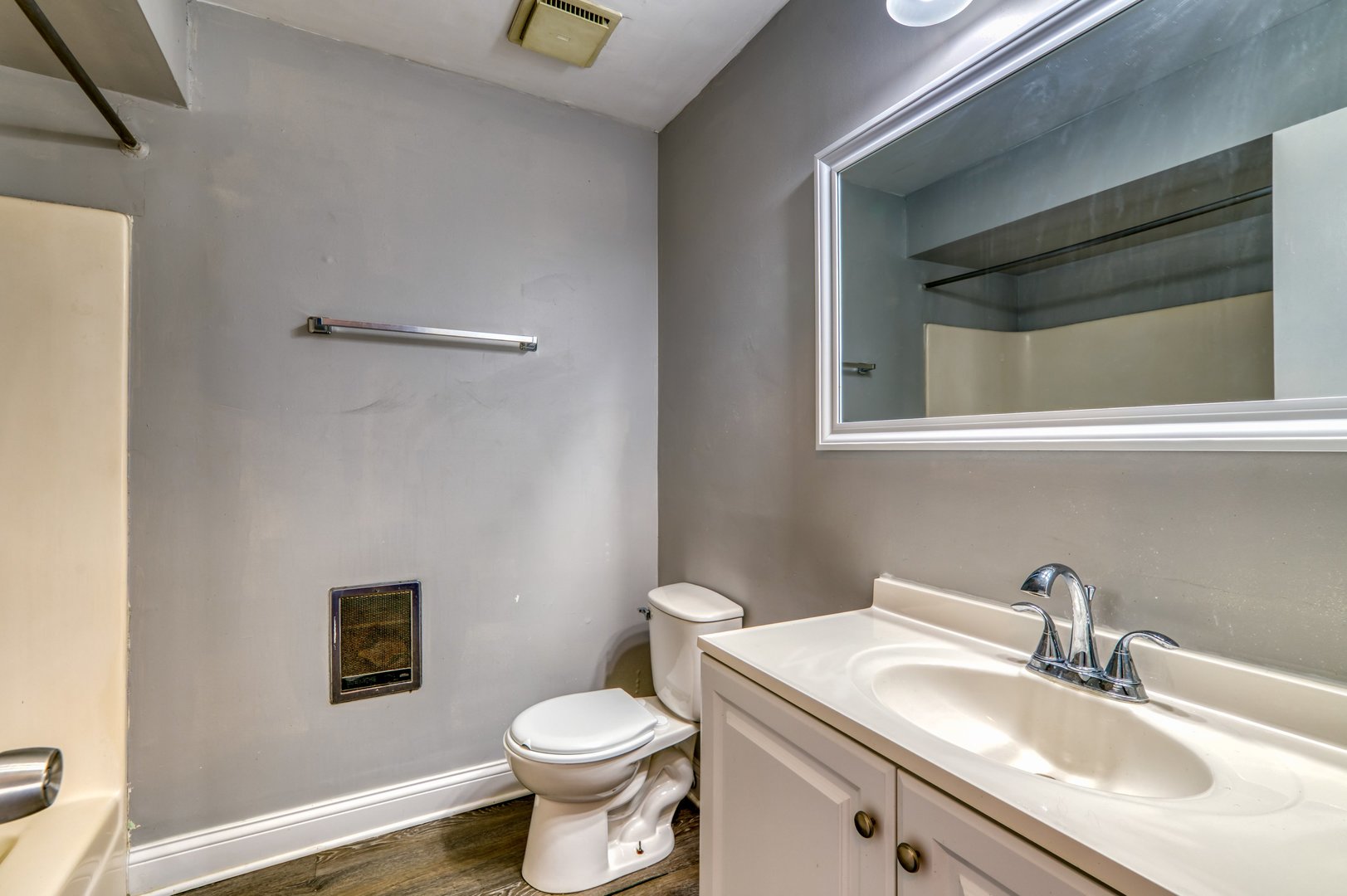 1713 Nelson Road, Unit 2 New Lenox, IL 60451 - Photo 8 of 10 a bathroom with a toilet sink vanity and mirror