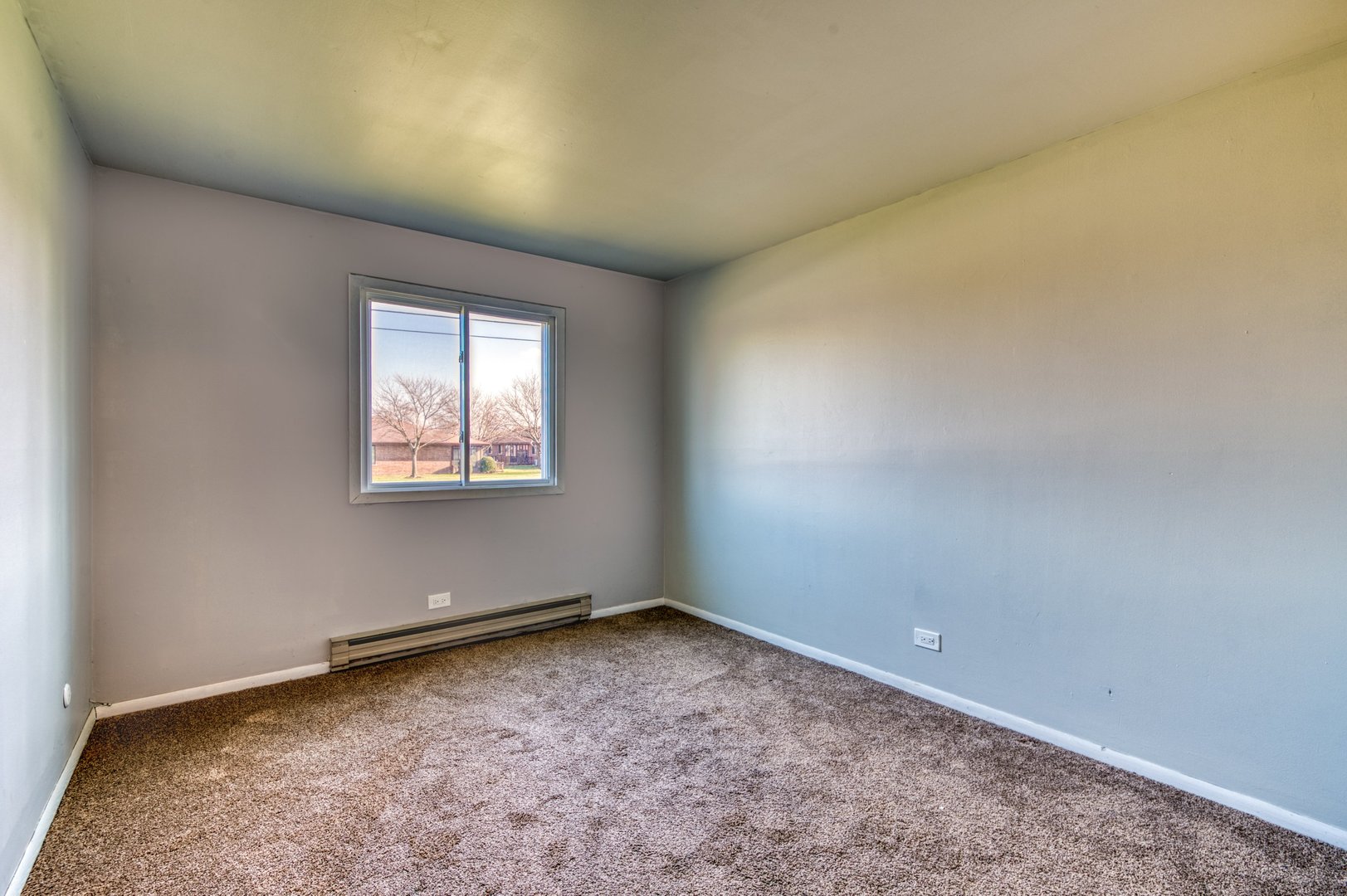 1713 Nelson Road, Unit 2 New Lenox, IL 60451 - Photo 9 of 10 an empty room with a workbench