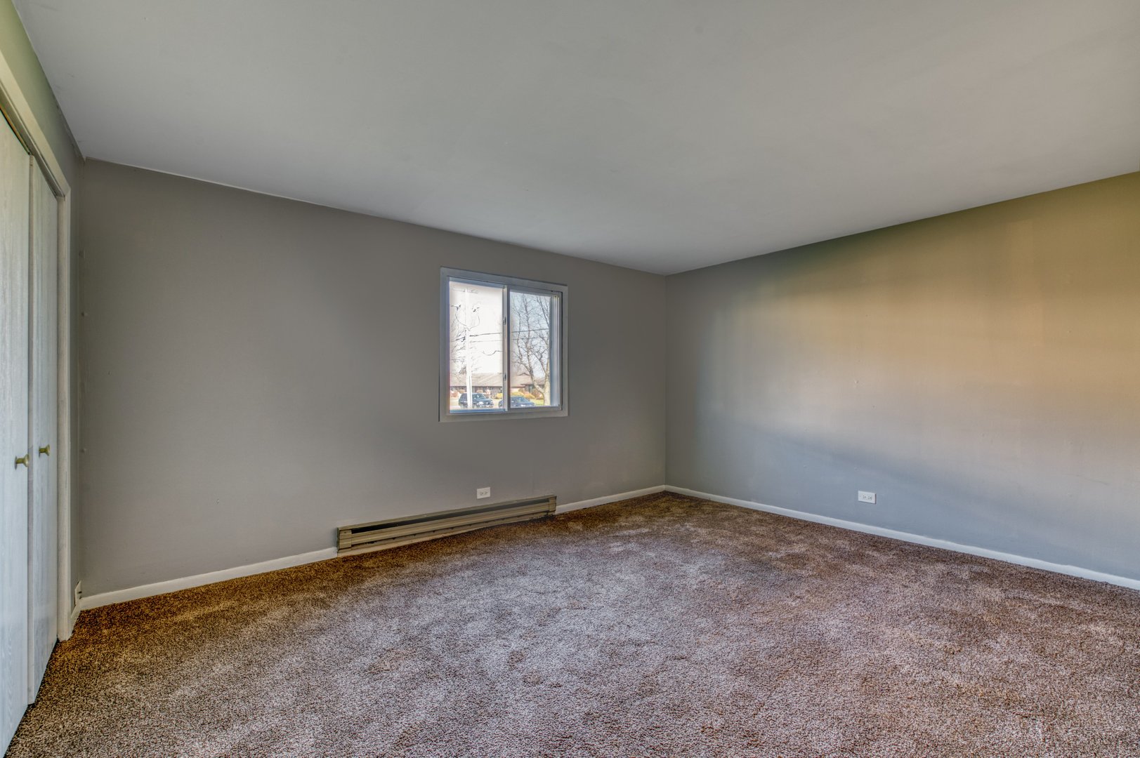 1713 Nelson Road, Unit 2 New Lenox, IL 60451 - Photo 10 of 10 a view of an empty room with a window