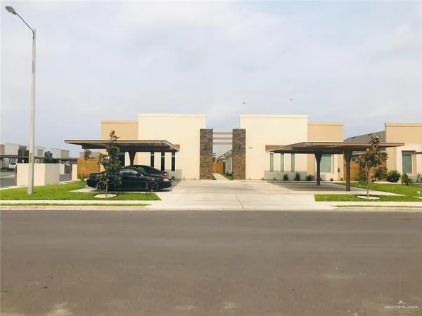 a view of building with a big yard