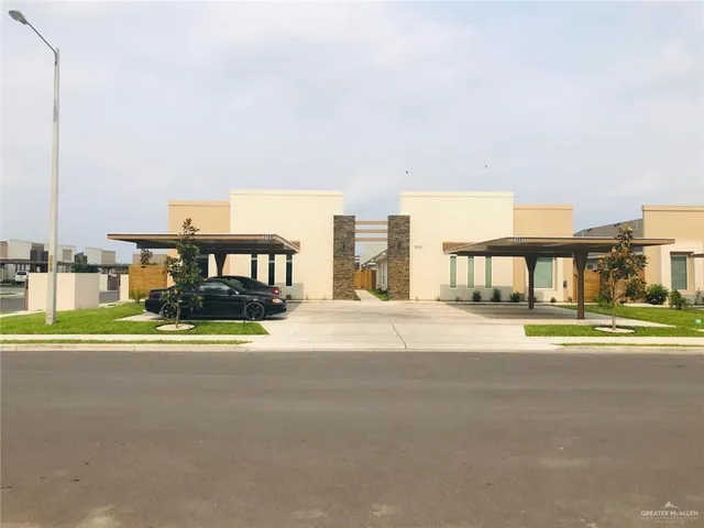 a view of building with a big yard