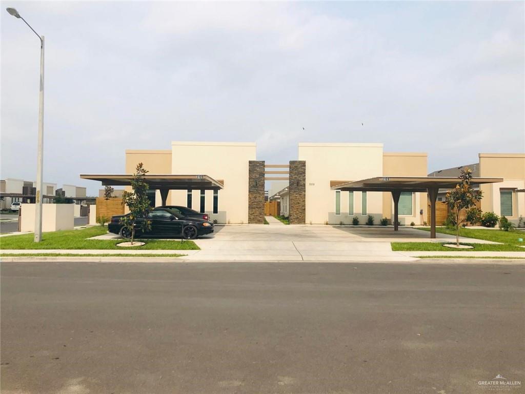 a view of building with a big yard