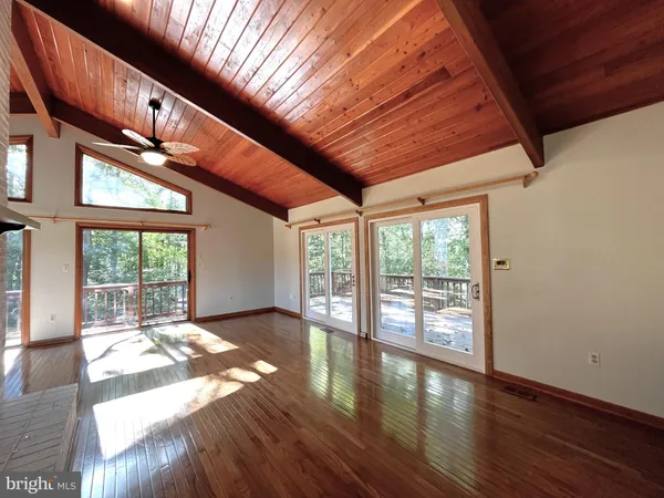 a view of an entryway with wooden floor