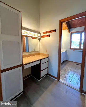 a bathroom with a sink a mirror and a bathtub