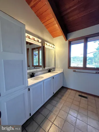 a bathroom with a glass shower door