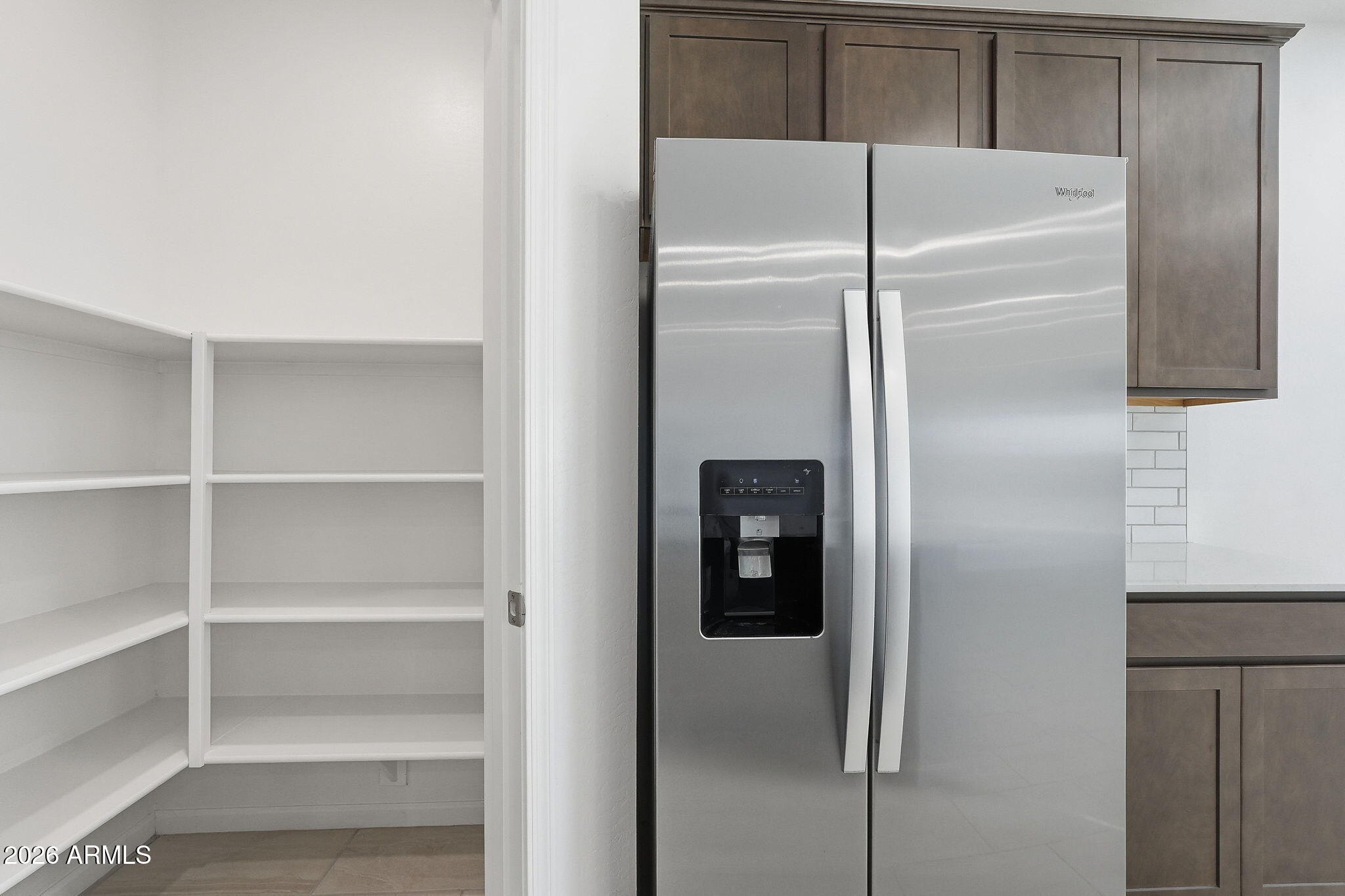 25489 West Fraktur Road Buckeye, AZ 85326 - Photo 16 of 39 a close view of refrigerator in kitchen
