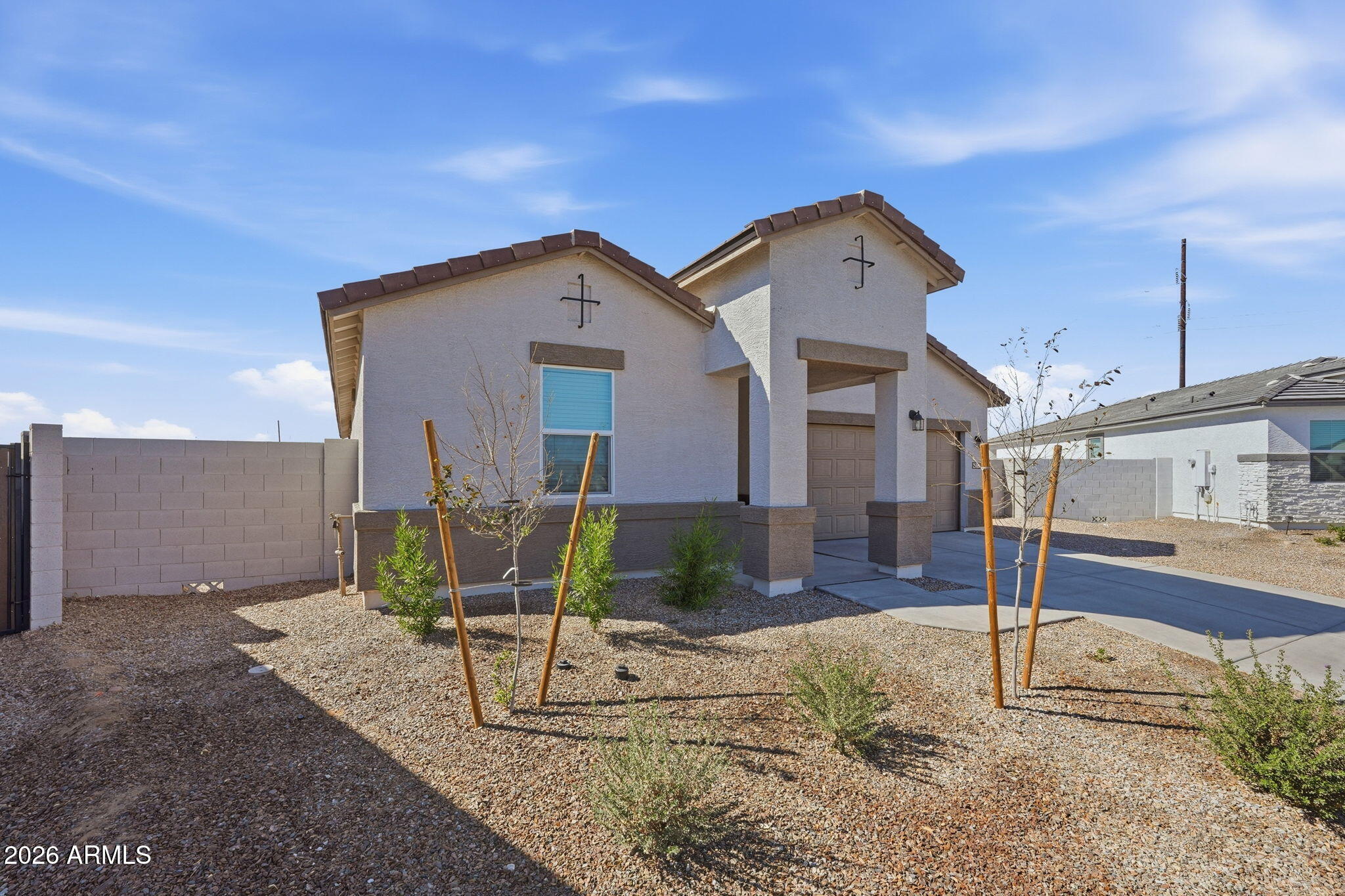 25489 West Fraktur Road Buckeye, AZ 85326 - Photo 2 of 39 a front view of a house with garden