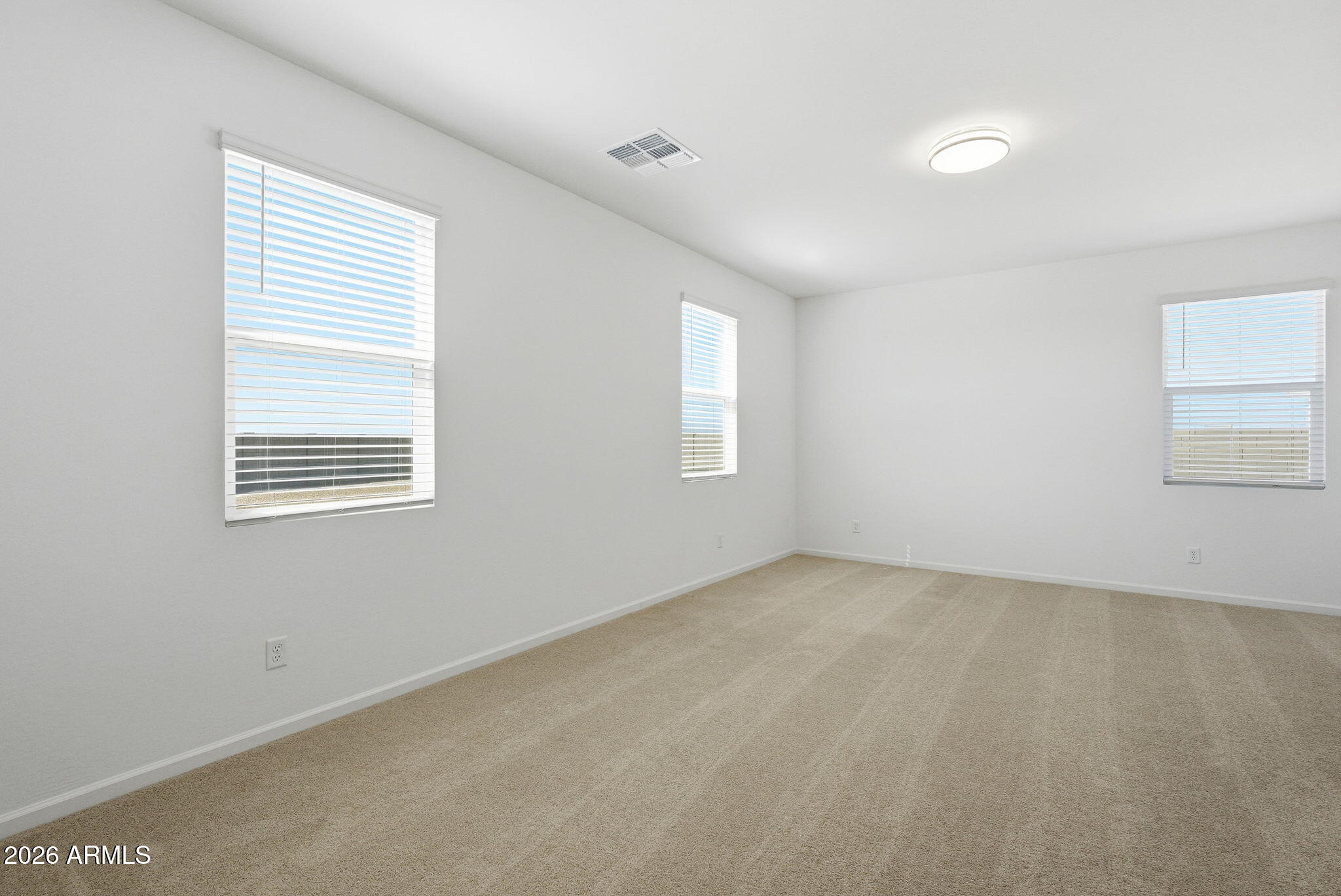 25489 West Fraktur Road Buckeye, AZ 85326 - Photo 21 of 39 an empty room with windows