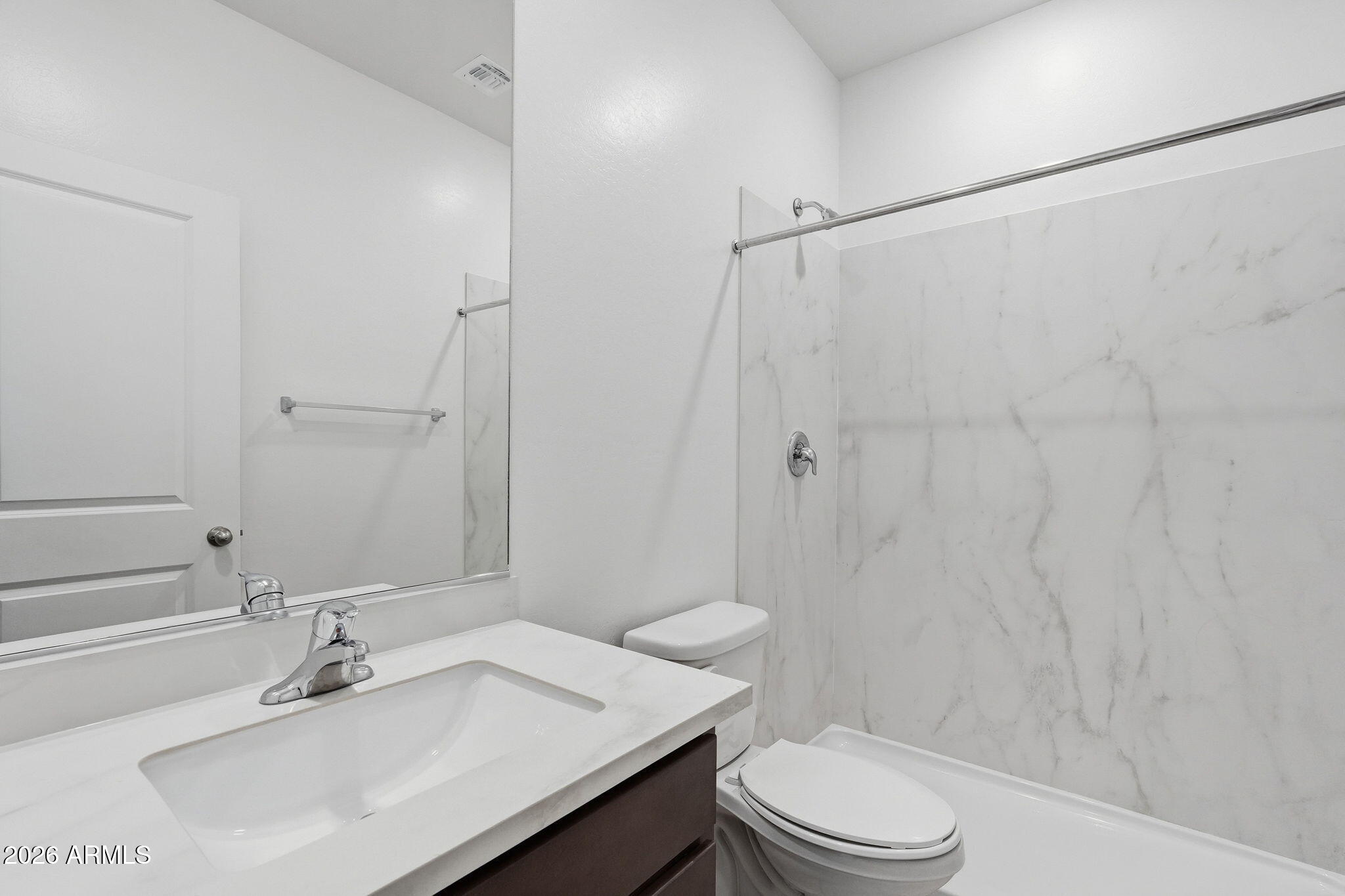 25489 West Fraktur Road Buckeye, AZ 85326 - Photo 28 of 39 a bathroom with a sink toilet and shower