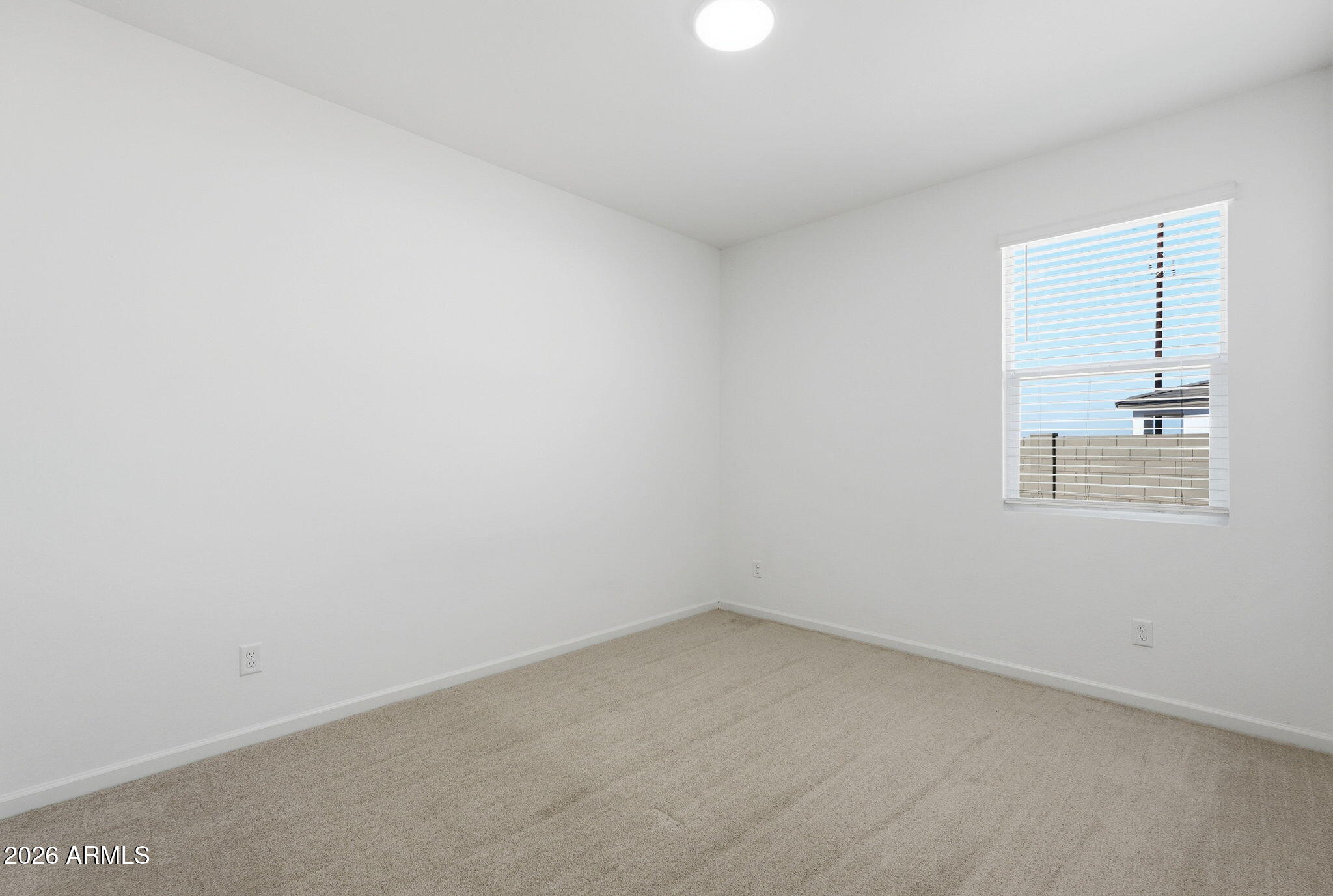 25489 West Fraktur Road Buckeye, AZ 85326 - Photo 29 of 39 an empty room with a window