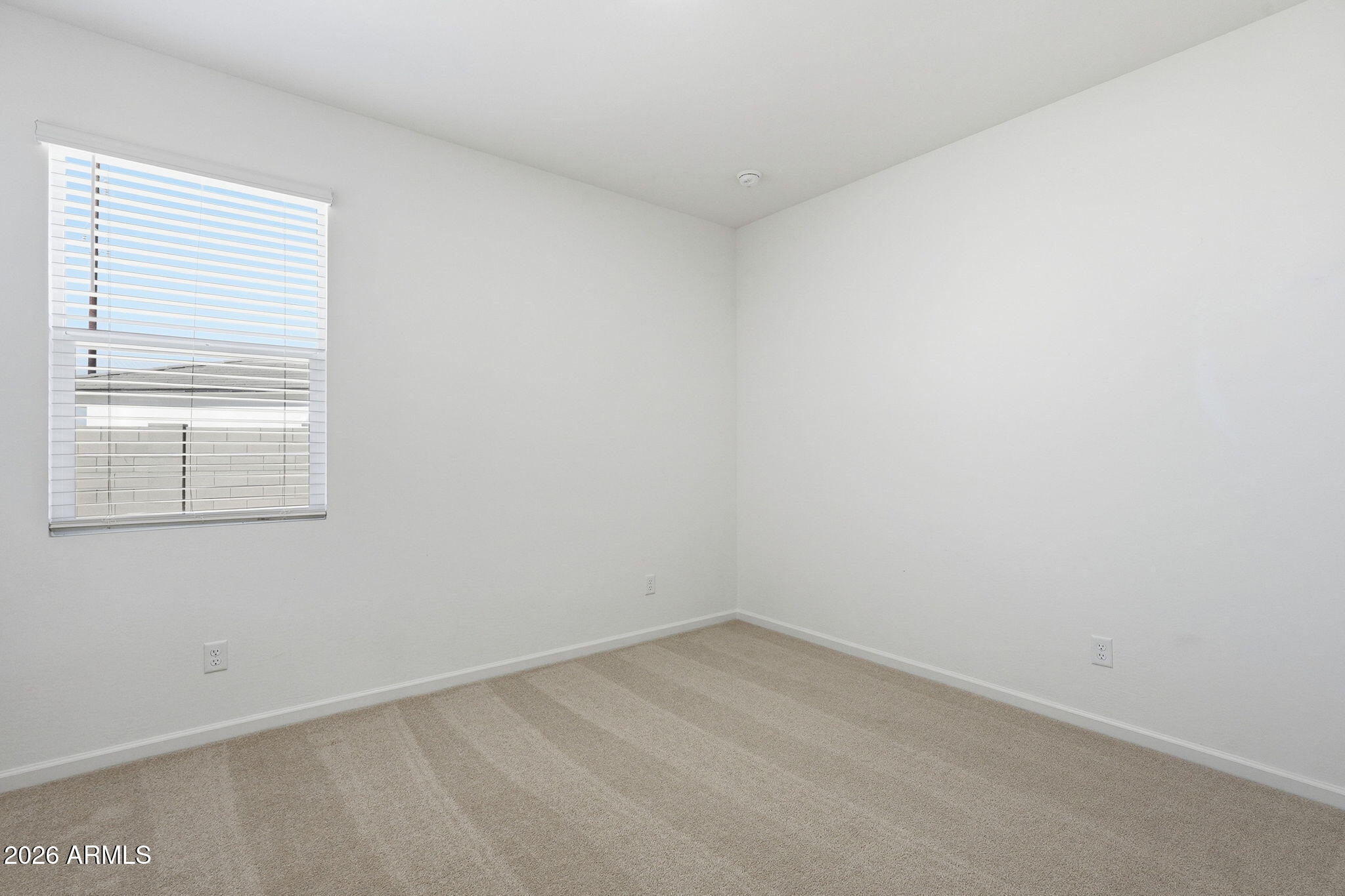 25489 West Fraktur Road Buckeye, AZ 85326 - Photo 31 of 39 an empty room with a window