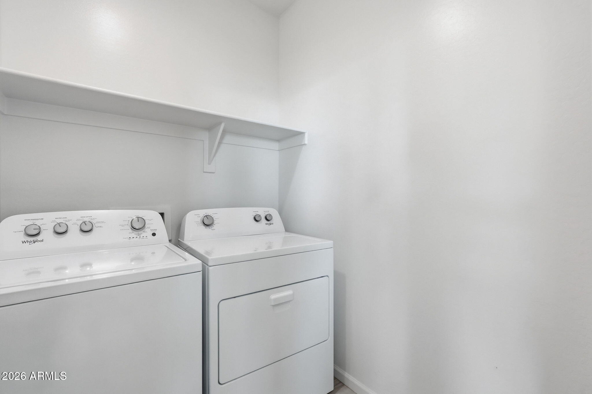 25489 West Fraktur Road Buckeye, AZ 85326 - Photo 33 of 39 a view of storage room with dryer and washer