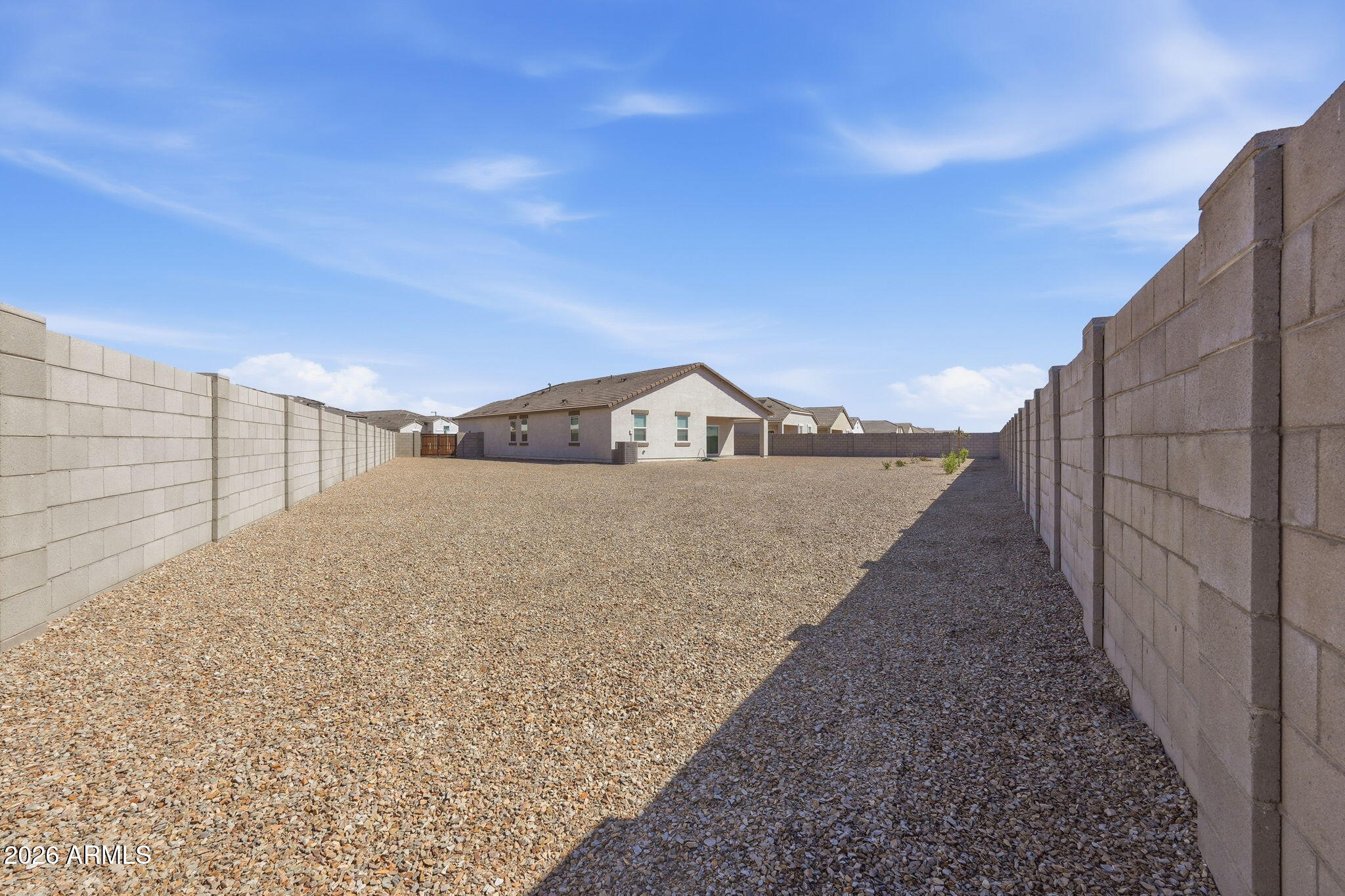 25489 West Fraktur Road Buckeye, AZ 85326 - Photo 38 of 39 a view of a dry yard with wooden fence