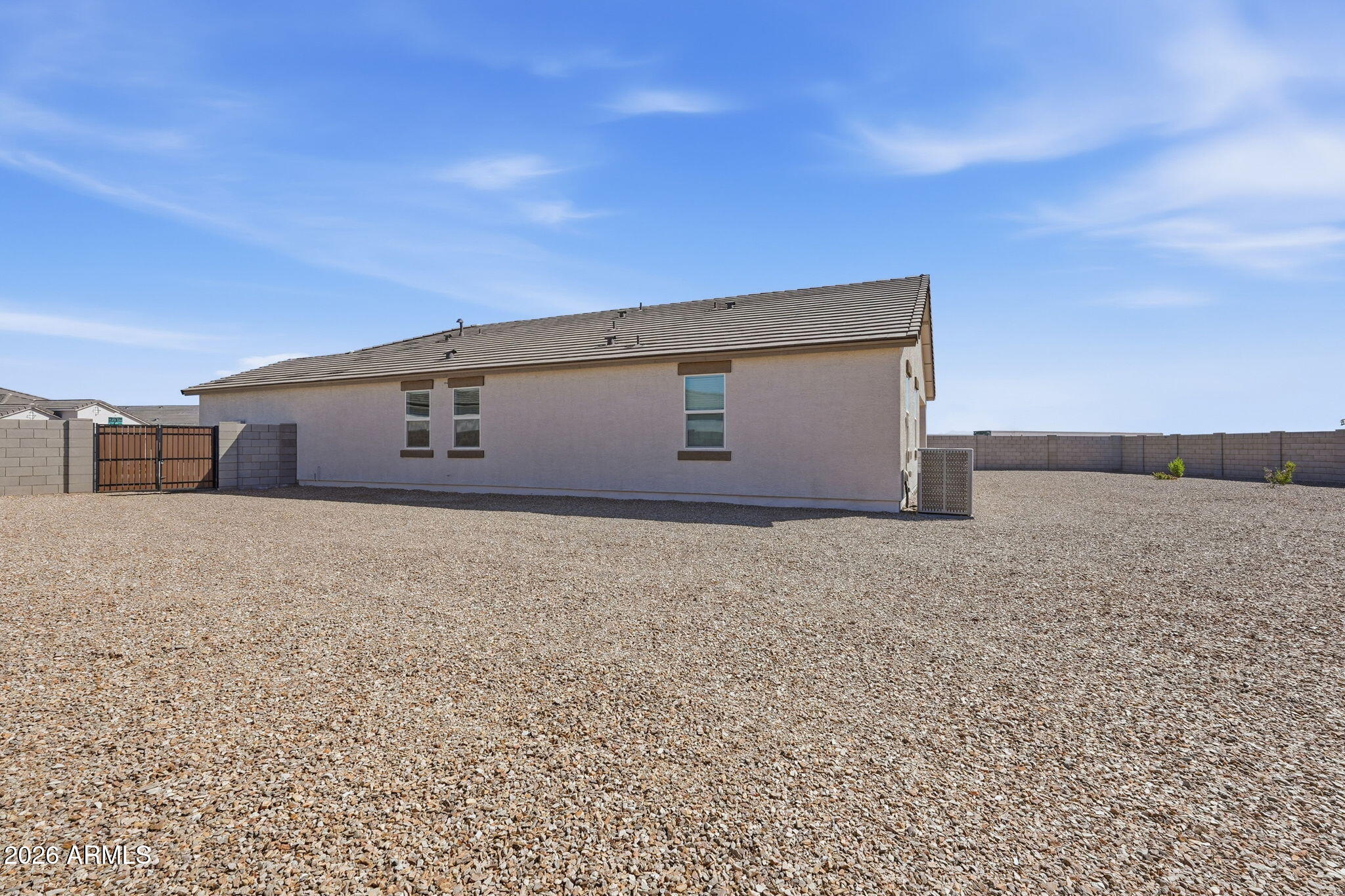 25489 West Fraktur Road Buckeye, AZ 85326 - Photo 39 of 39 a front view of a house with a yard