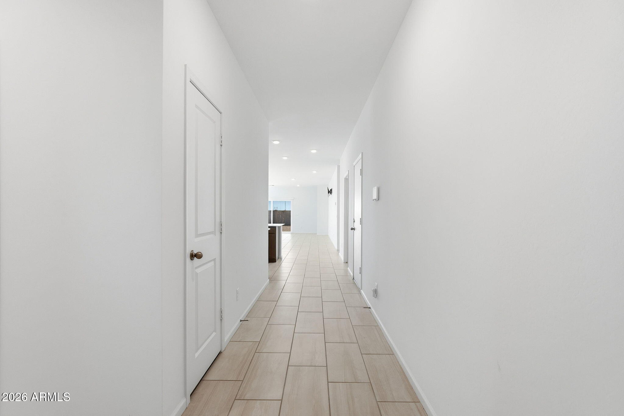 25489 West Fraktur Road Buckeye, AZ 85326 - Photo 5 of 39 a hallway with white doors