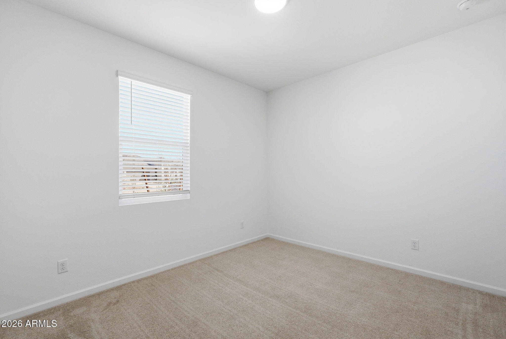 25489 West Fraktur Road Buckeye, AZ 85326 - Photo 6 of 39 an empty room with a window