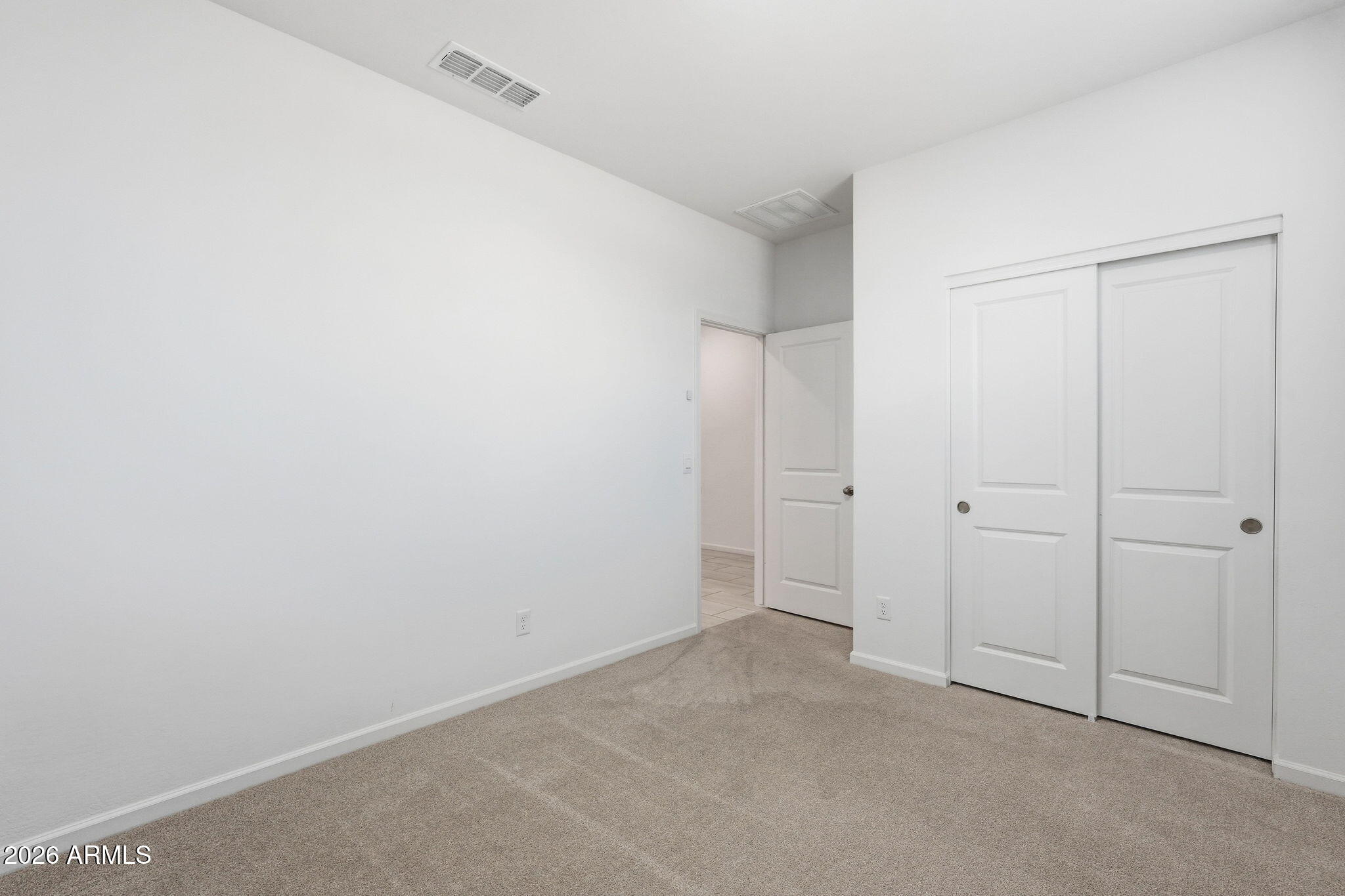 25489 West Fraktur Road Buckeye, AZ 85326 - Photo 7 of 39 a view of an empty room