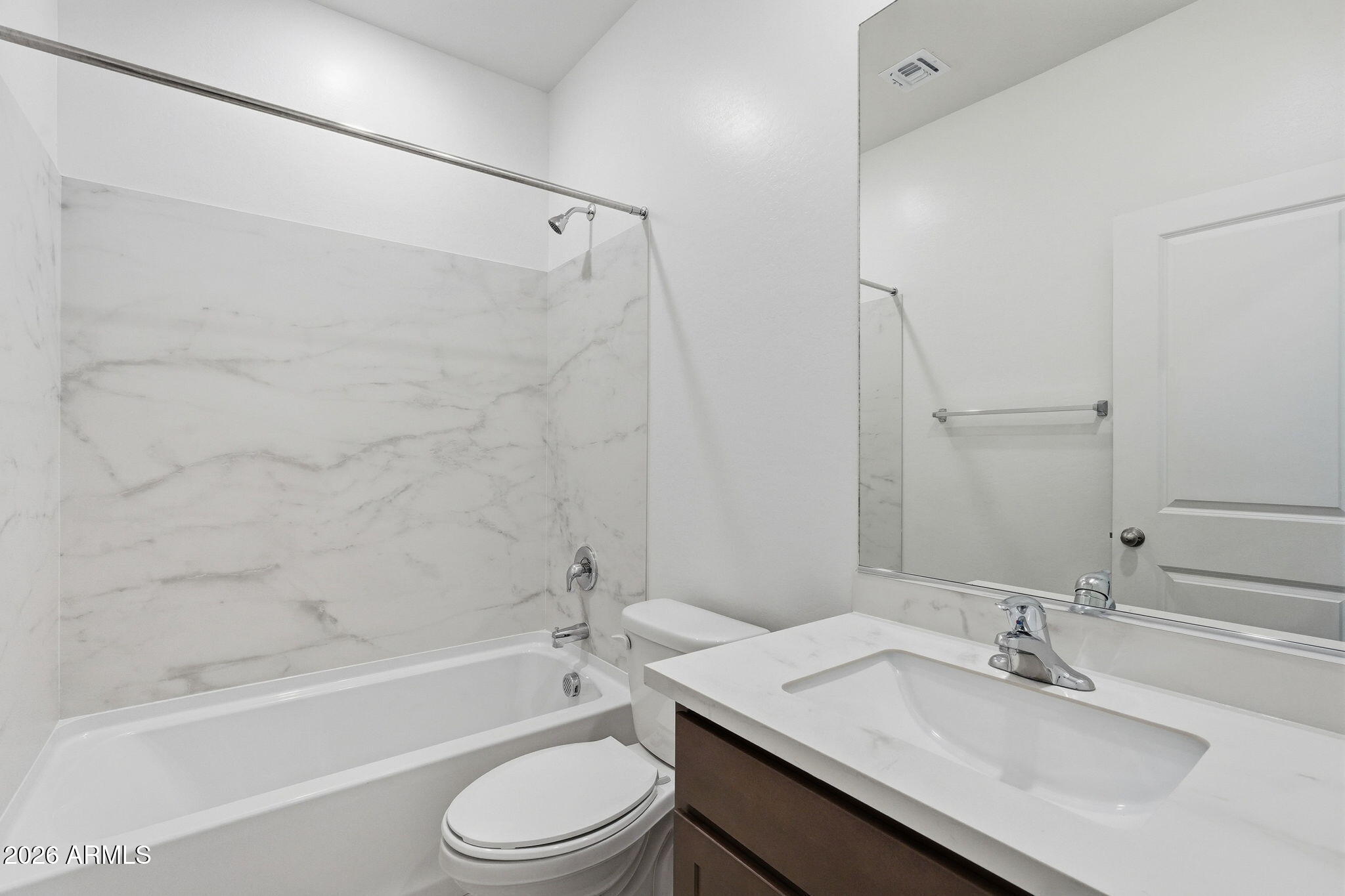 25489 West Fraktur Road Buckeye, AZ 85326 - Photo 8 of 39 a bathroom with a granite countertop sink toilet and shower