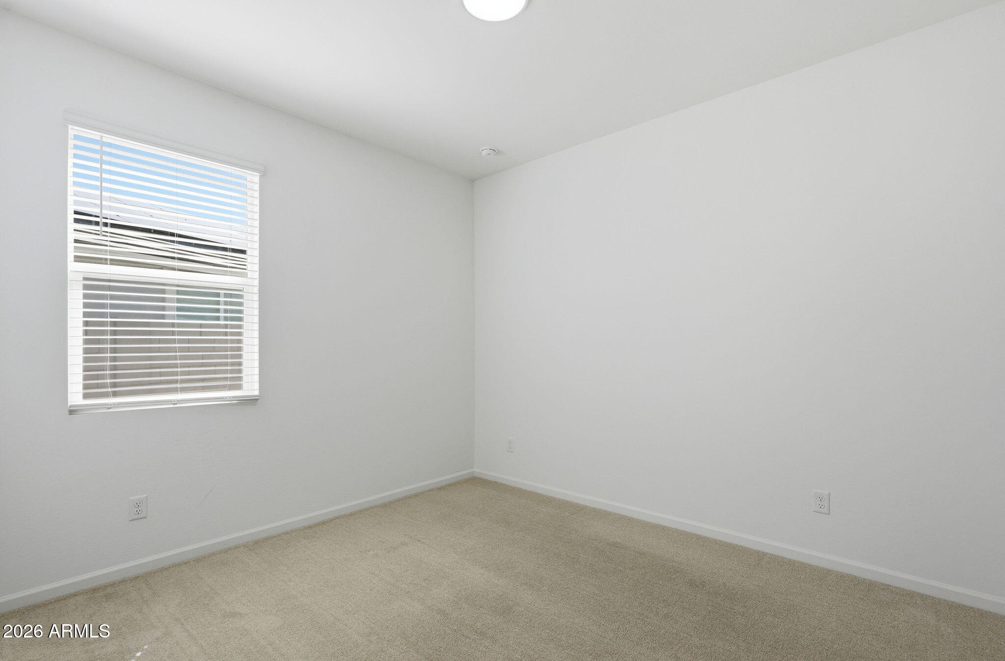 25489 West Fraktur Road Buckeye, AZ 85326 - Photo 9 of 39 an empty room with a window