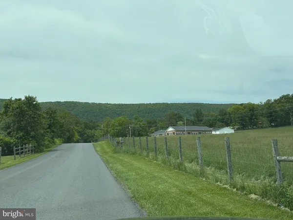 a view of a lake with a yard