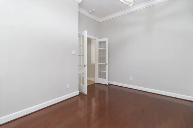 a kitchen with granite countertop a sink a counter top space and cabinets