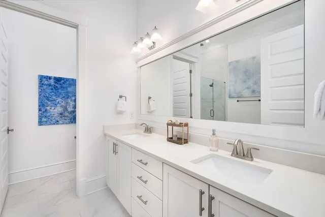 a bathroom with a sink a vanity and a mirror