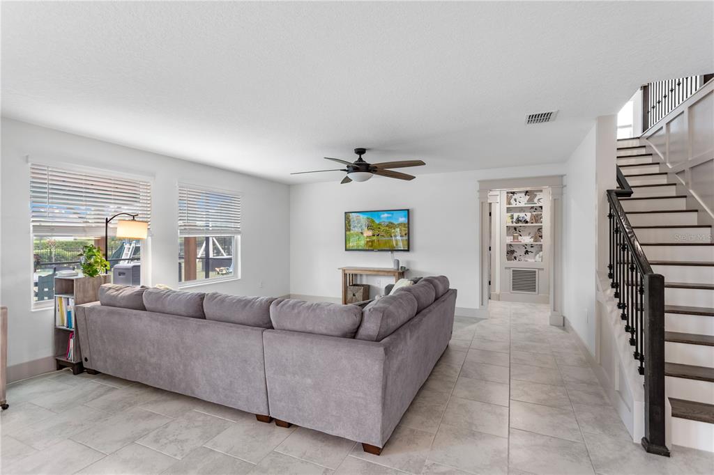 5693 Alenlon Way Mount Dora, FL 32757 - Photo 13 of 40 a living room with furniture and a window