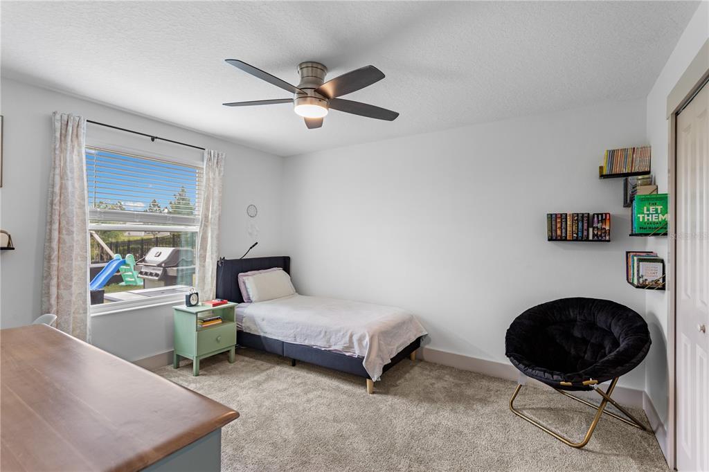 5693 Alenlon Way Mount Dora, FL 32757 - Photo 16 of 40 a room with a bed and a window