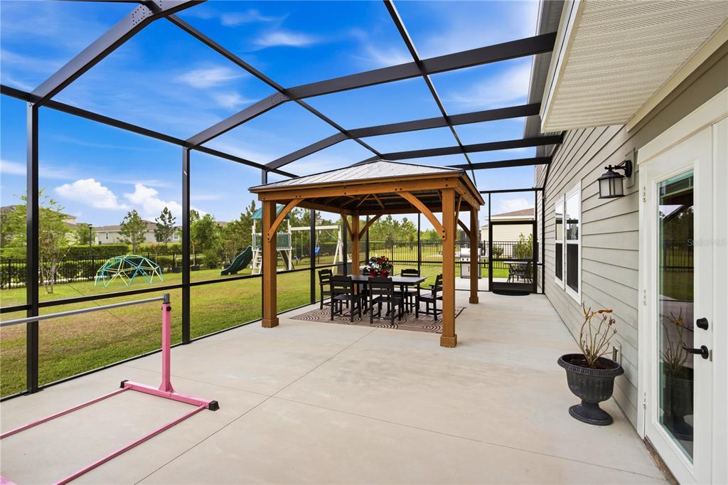 5693 Alenlon Way Mount Dora, FL 32757 - Photo 33 of 40 a view of a porch with furniture and a porch