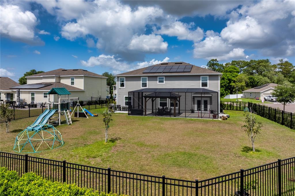 5693 Alenlon Way Mount Dora, FL 32757 - Photo 39 of 40 a view of a swimming pool with a patio