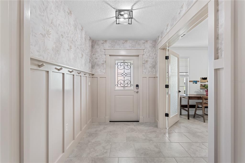 5693 Alenlon Way Mount Dora, FL 32757 - Photo 4 of 40 a view of a hallway with closet and a livingroom view