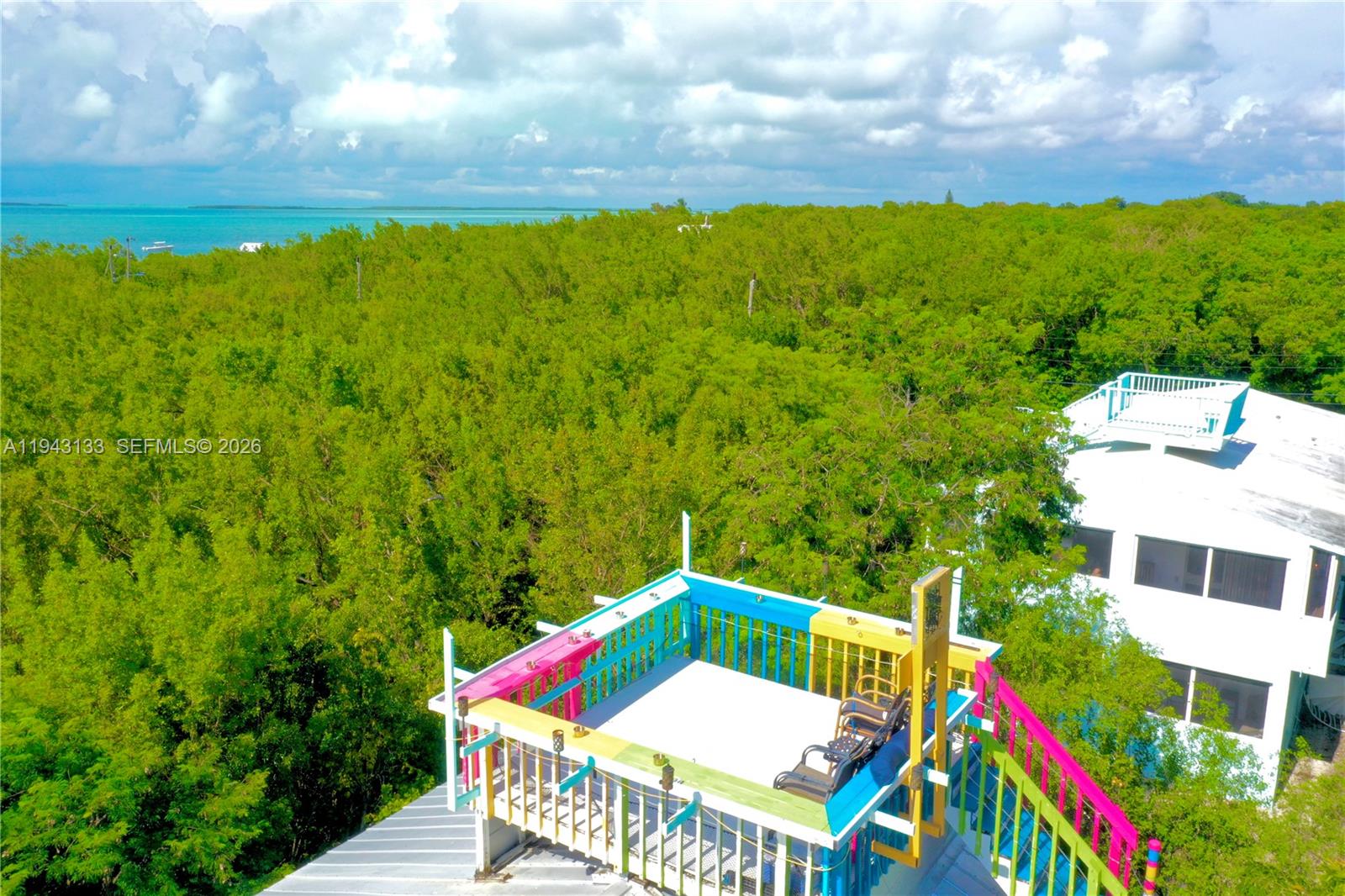 61 Central Avenue Key Largo, FL 33037 - Photo 14 of 21 a view of balcony with yard and outdoor seating