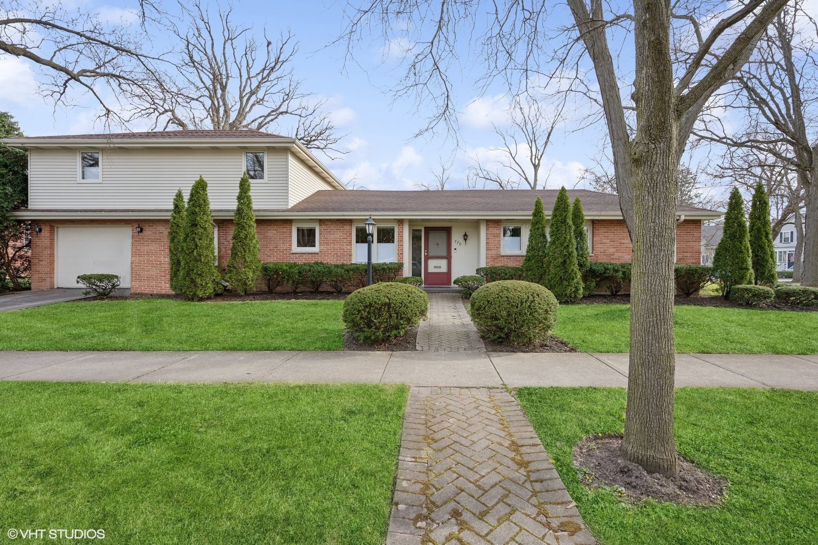 770 Cherry Street Winnetka, IL 60093 - Photo 1 of 1 a front view of house with yard and green space