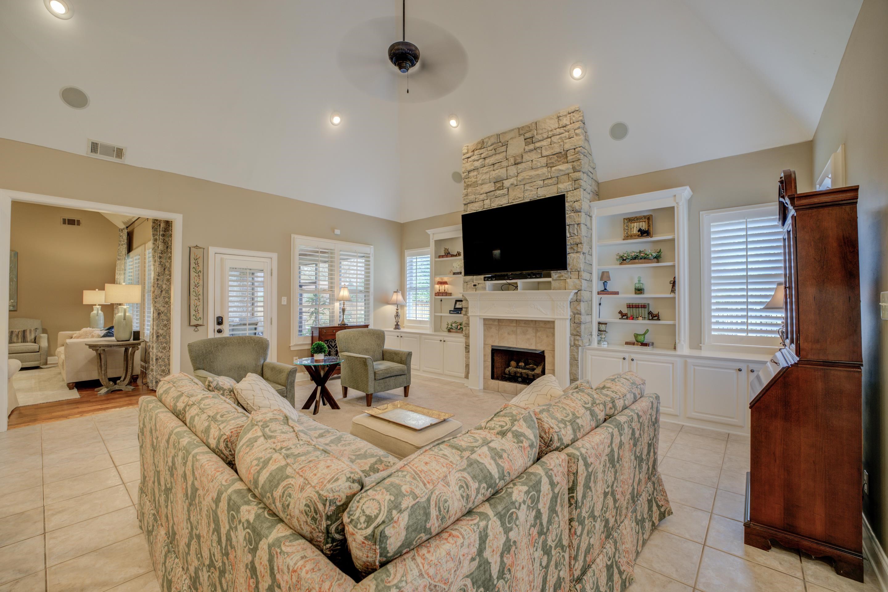 1238 Braystone Trail Collierville, TN 38017 - Photo 12 of 40 Hearth Room with vaulted ceilings, built-ins, stacked stone fireplace, access to screened porch.