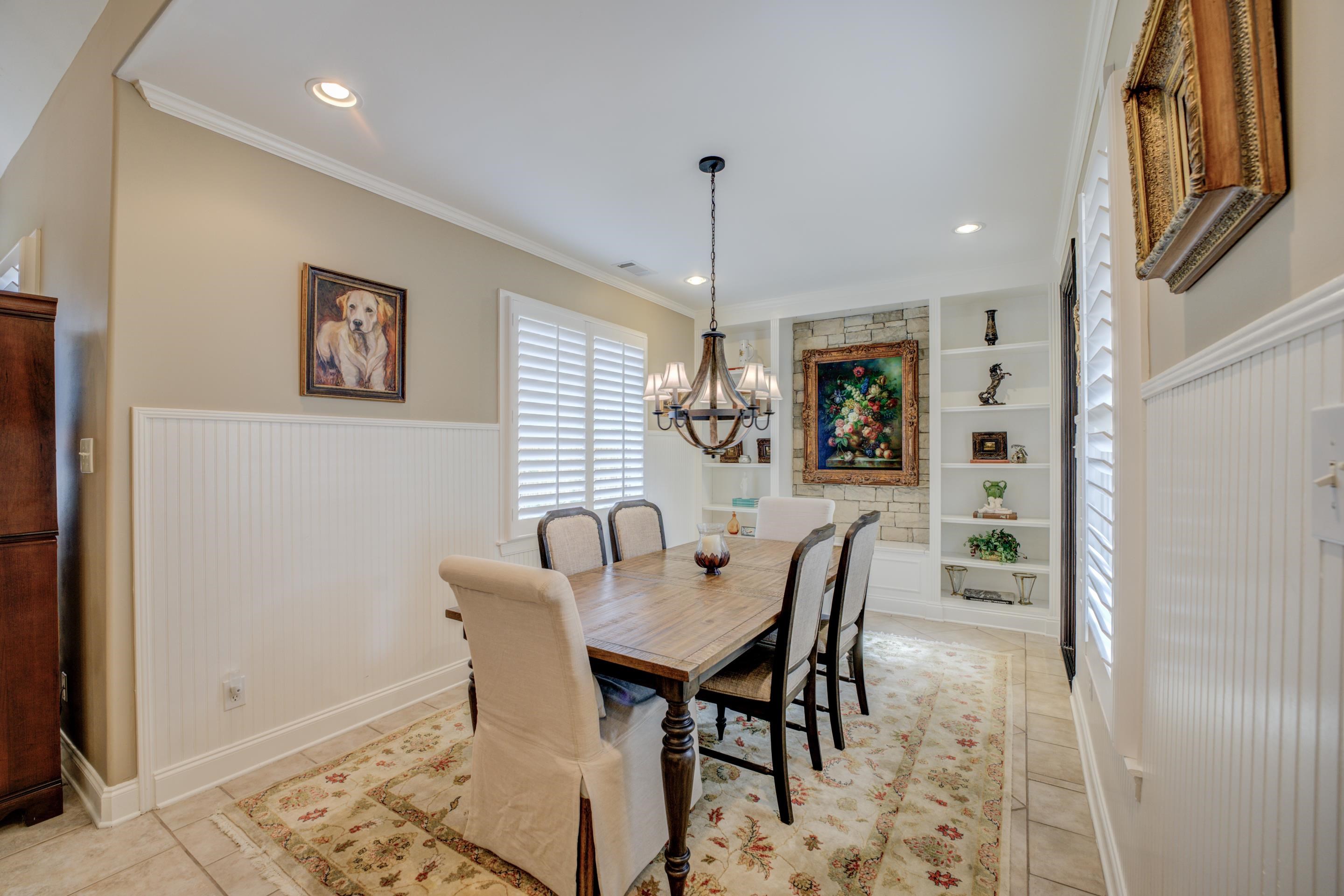 1238 Braystone Trail Collierville, TN 38017 - Photo 16 of 40 Oversized breakfast room with stone accent wall, built-ins, and friend's entrance.