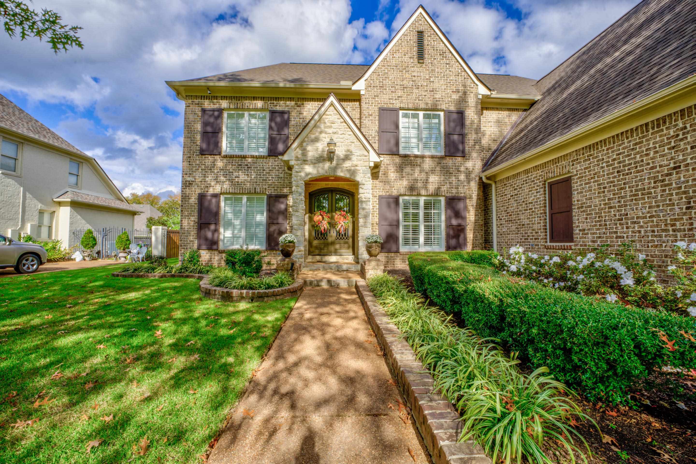 1238 Braystone Trail Collierville, TN 38017 - Photo 2 of 40 Improved landscaping, beautiful color, iron front doors