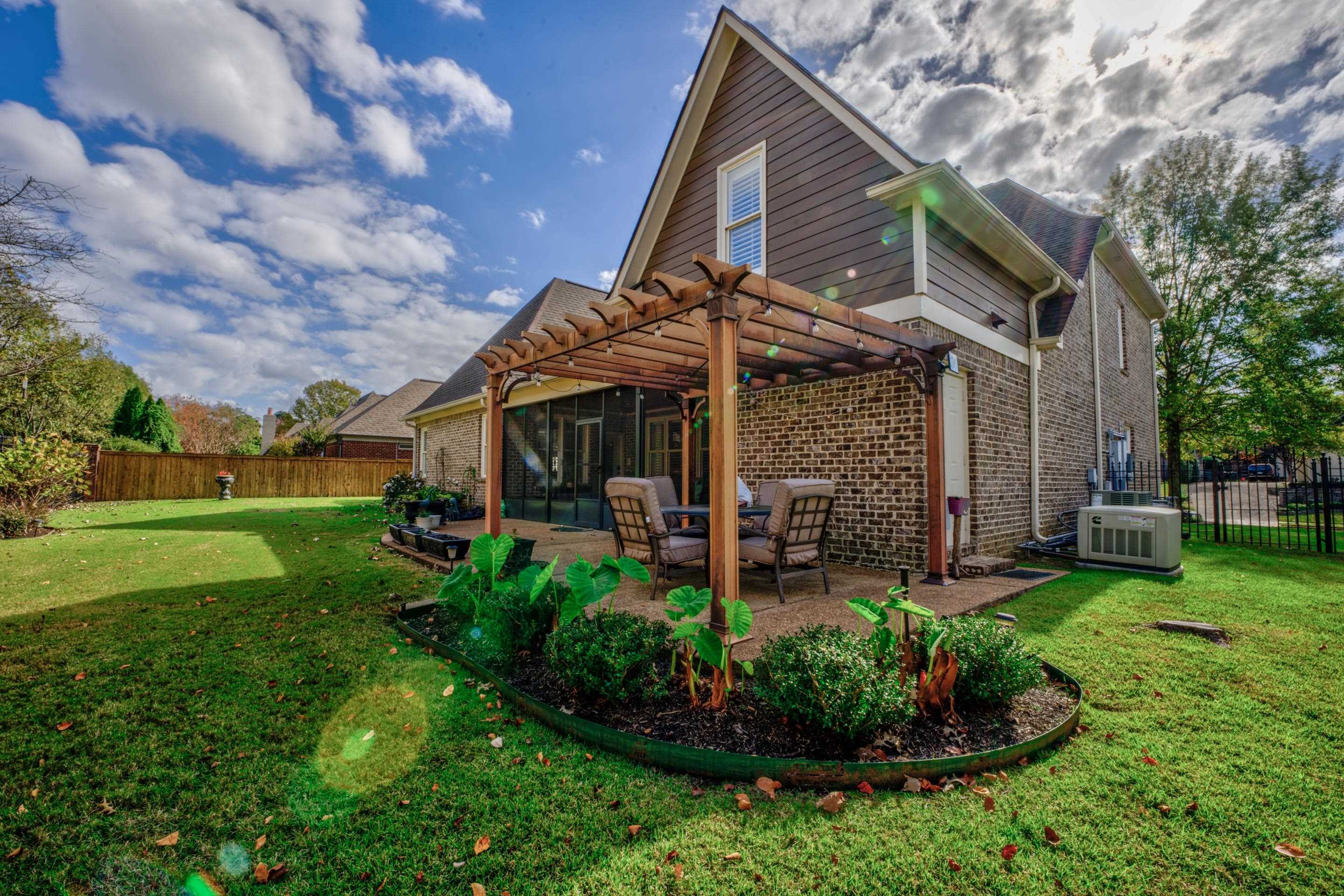 1238 Braystone Trail Collierville, TN 38017 - Photo 31 of 40 Generator, additional storage room and gorgeous landscaping.