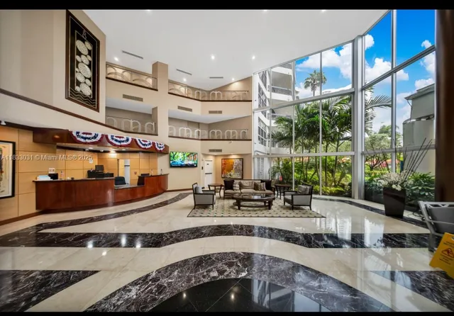 a view of a living room and kitchen