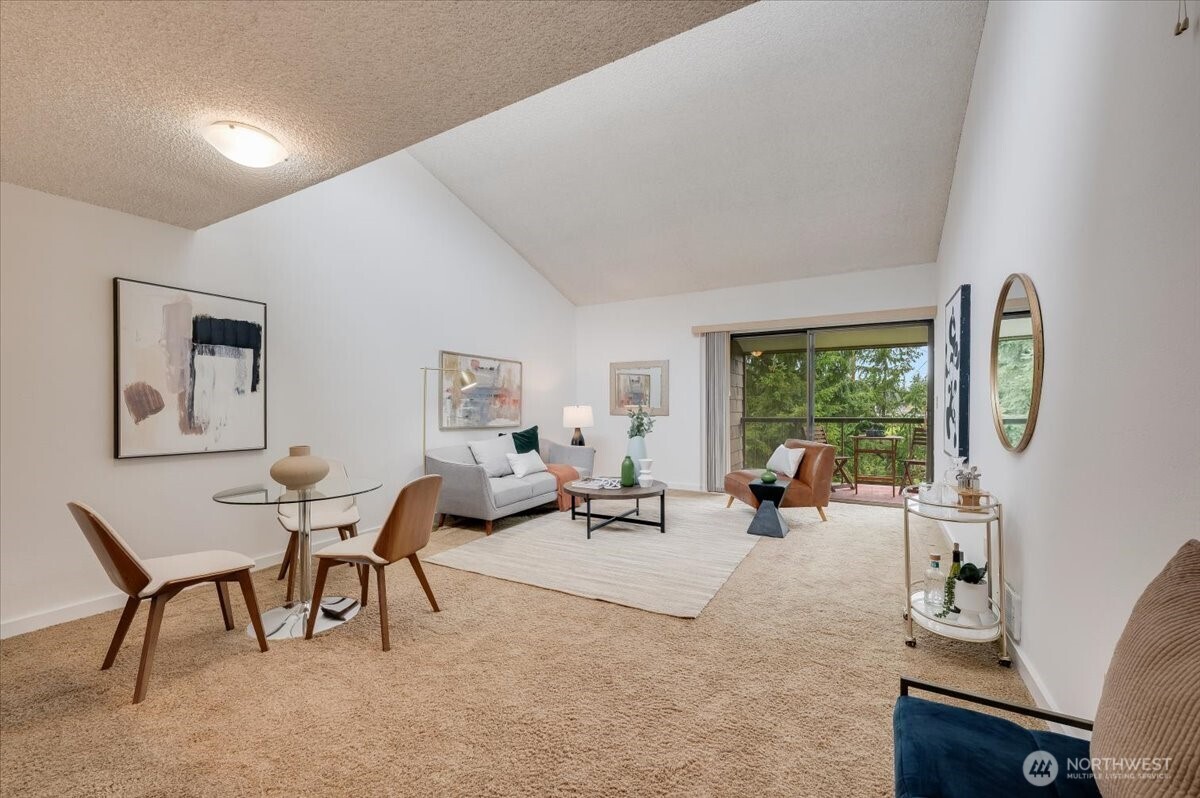 13680 Northeast 69th Street, Unit 656 Redmond, WA 98052 - Photo 11 of 33 a living room with furniture and a large window