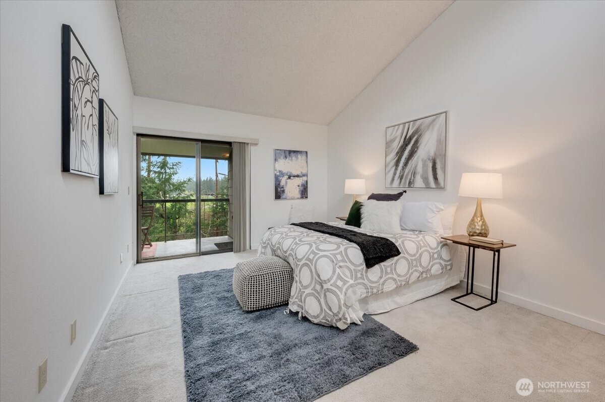 13680 Northeast 69th Street, Unit 656 Redmond, WA 98052 - Photo 16 of 33 a bedroom with a bed and window
