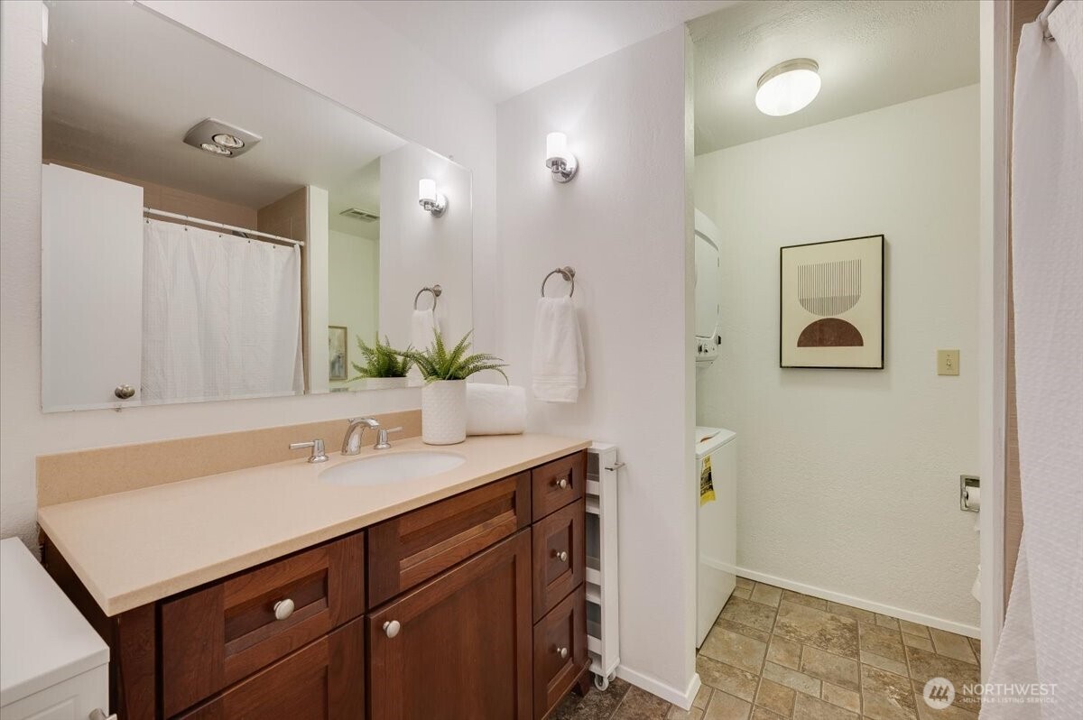 13680 Northeast 69th Street, Unit 656 Redmond, WA 98052 - Photo 18 of 33 a bathroom with a sink and a mirror