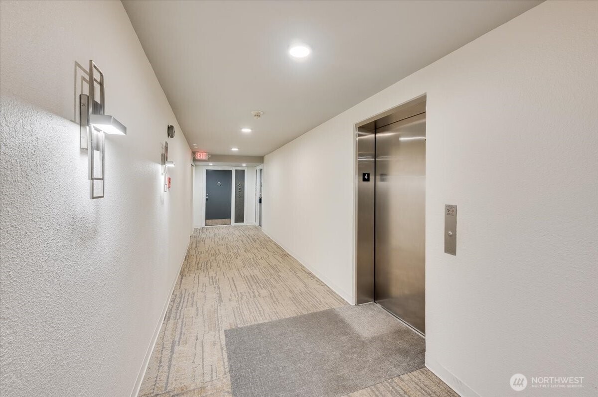 13680 Northeast 69th Street, Unit 656 Redmond, WA 98052 - Photo 24 of 33 a view of hallway with wooden floor