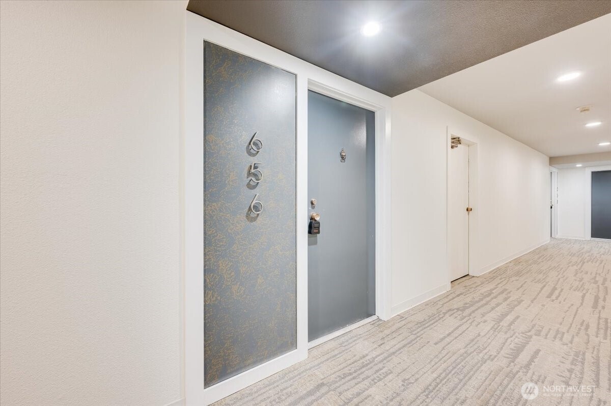 13680 Northeast 69th Street, Unit 656 Redmond, WA 98052 - Photo 5 of 33 a view of hallway with wooden floor