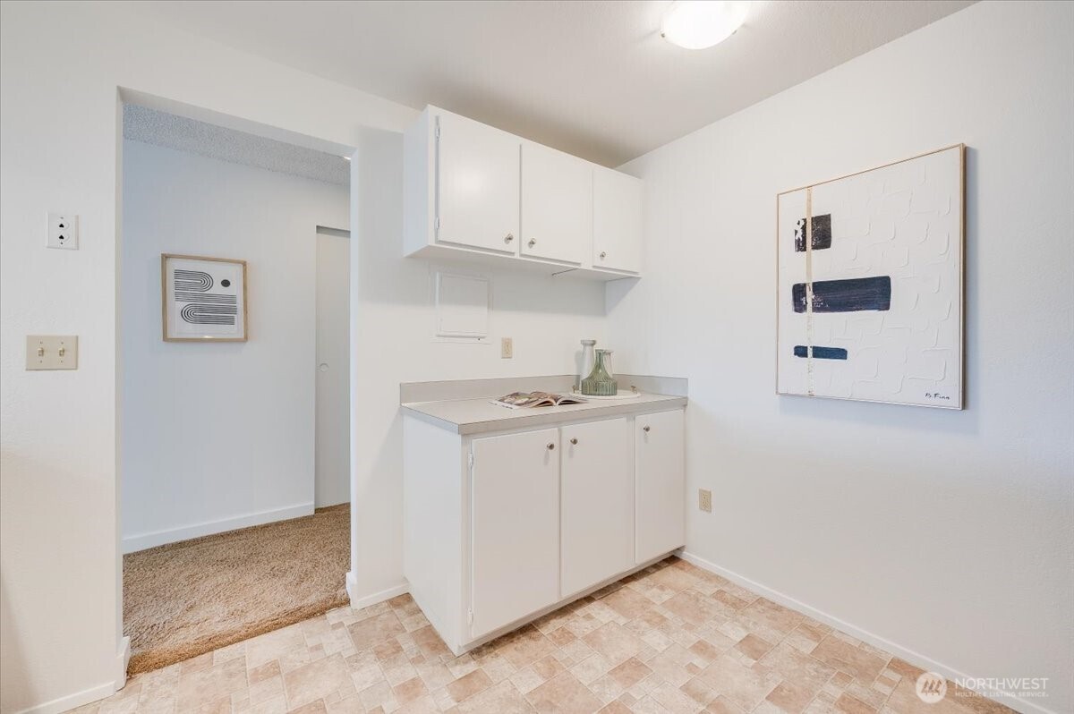 13680 Northeast 69th Street, Unit 656 Redmond, WA 98052 - Photo 10 of 33 a utility room with cabinets washer and dryer