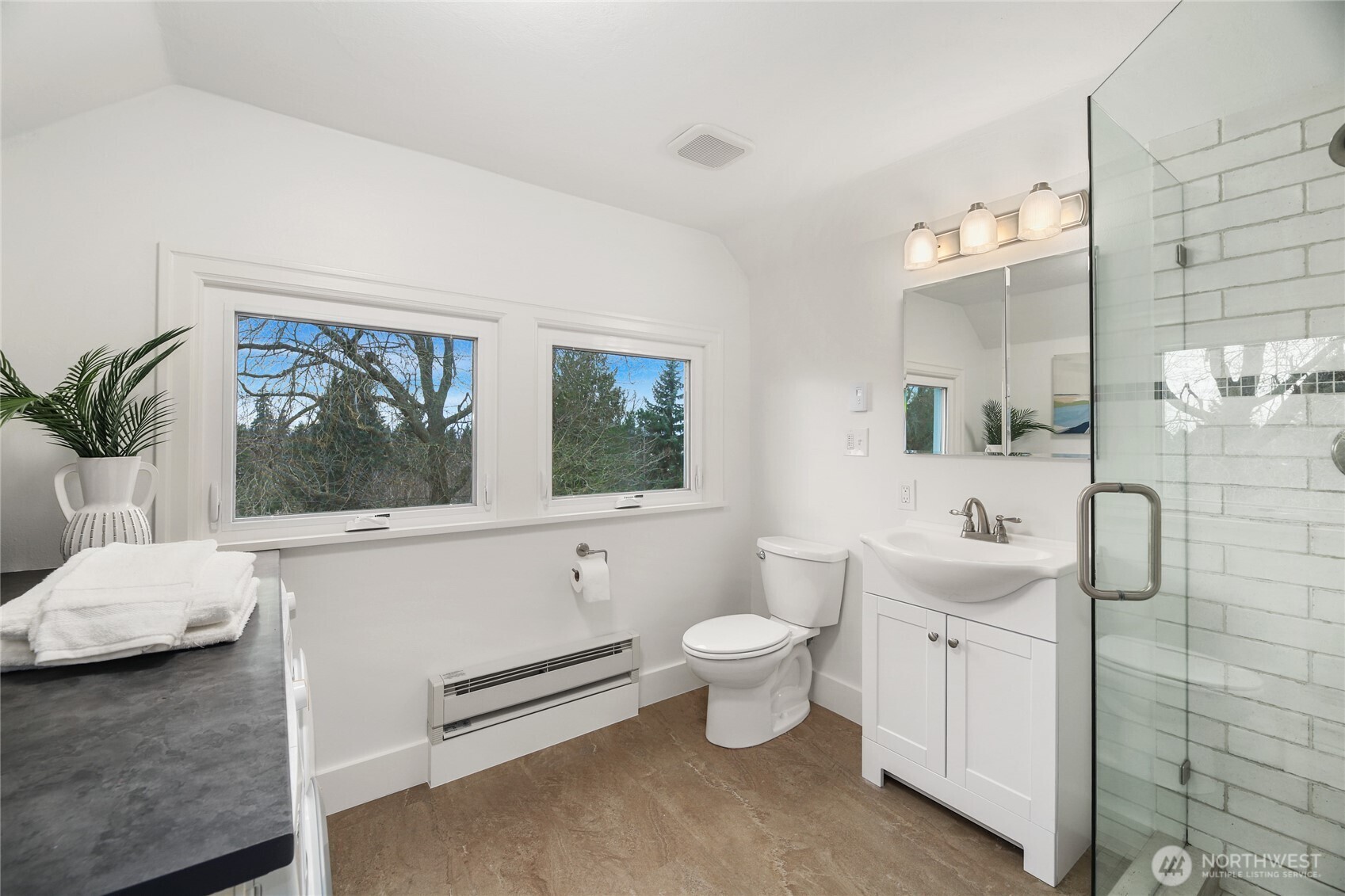 3239 45th Avenue Southwest Seattle, WA 98116 - Photo 17 of 39 a bathroom with a toilet sink and mirror