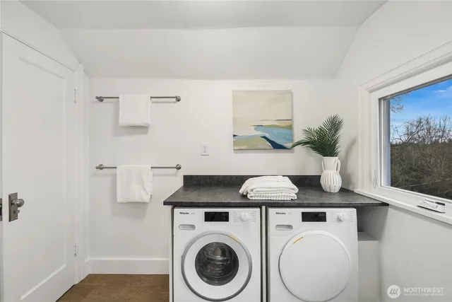 a view of kitchen sink and wooden floor