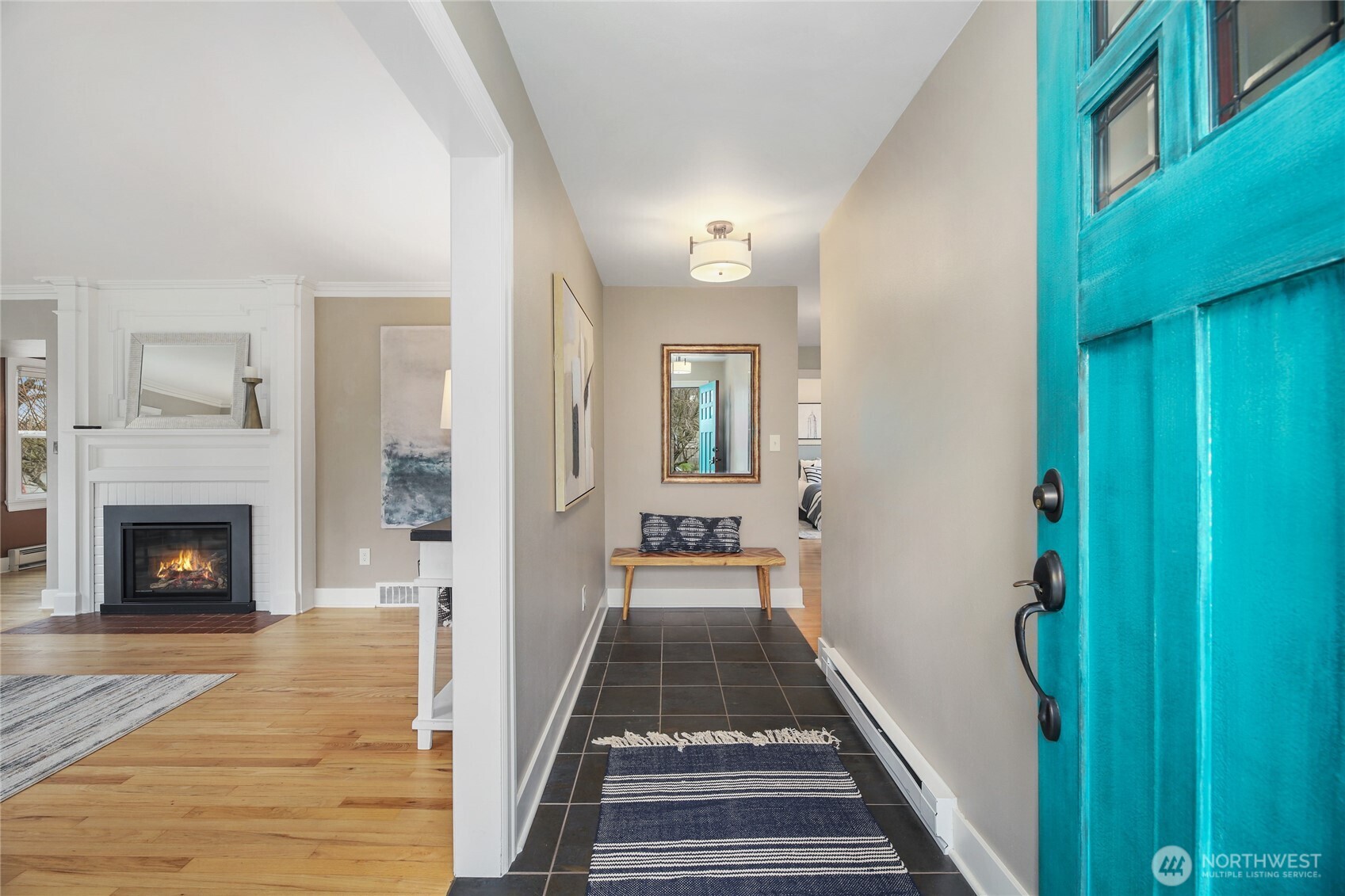 3239 45th Avenue Southwest Seattle, WA 98116 - Photo 2 of 39 a view of a hallway to a livingroom with furniture and fireplace