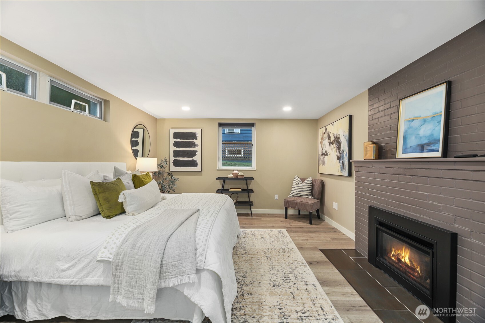 3239 45th Avenue Southwest Seattle, WA 98116 - Photo 29 of 39 a bed room with a bed and a fireplace
