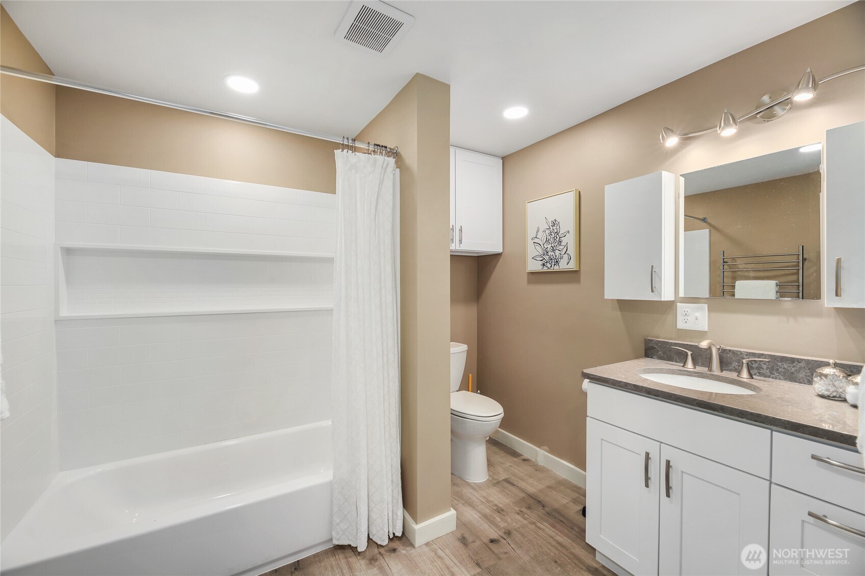 3239 45th Avenue Southwest Seattle, WA 98116 - Photo 31 of 39 a bathroom with a sink a toilet and a bathtub