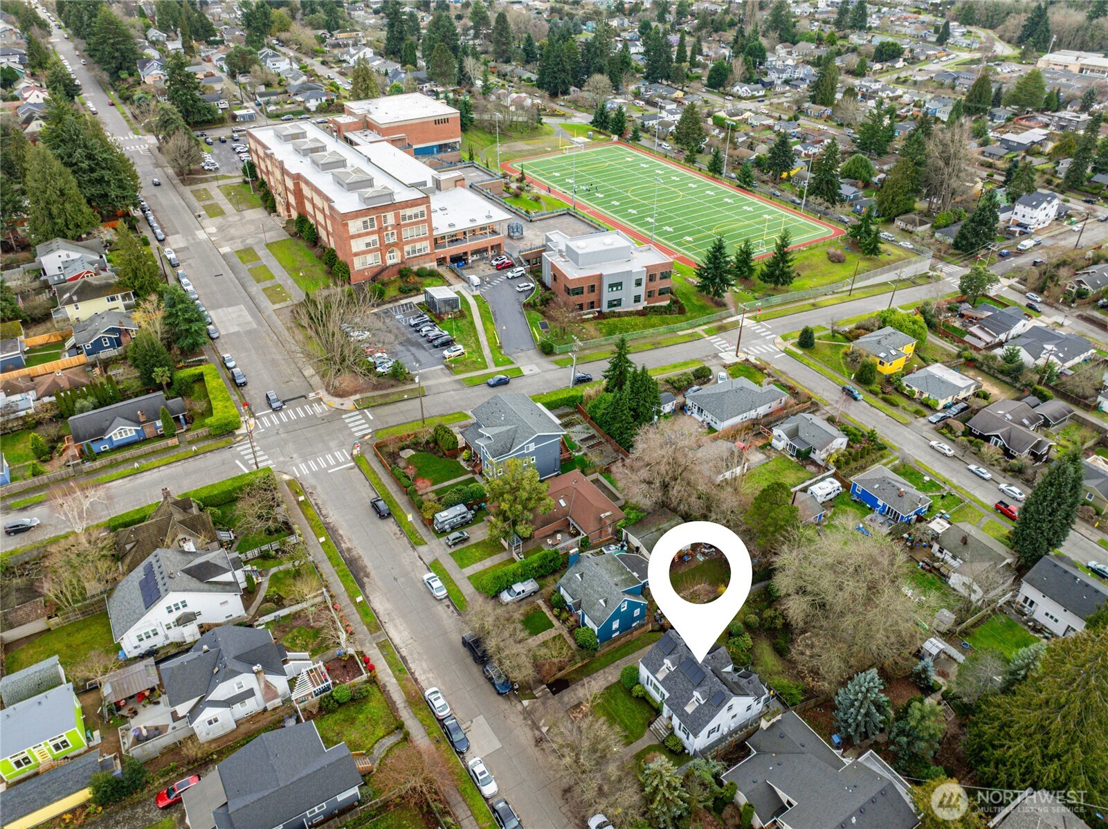 3239 45th Avenue Southwest Seattle, WA 98116 - Photo 35 of 39 an aerial view of a house with a swimming pool yard and outdoor seating